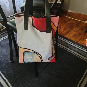 Gidgette Ahmad added a photo of their purchase