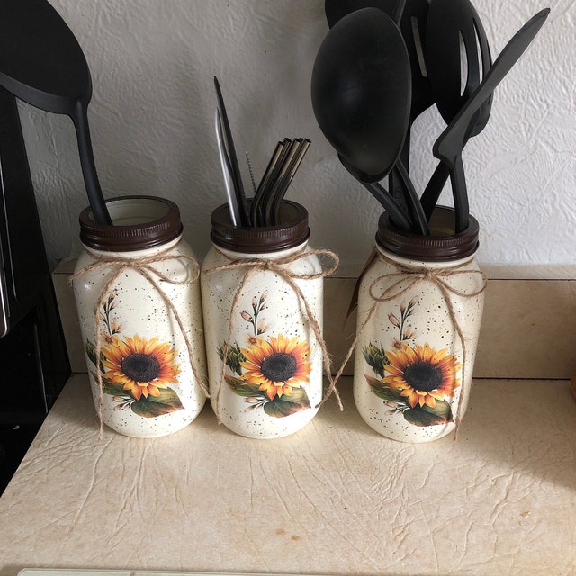 Sunflower kitchen cookie jar, 3 piece canister set, paper towel holder,  napkin holder, utensil holder and misc decor for Sale in Glendora, CA -  OfferUp