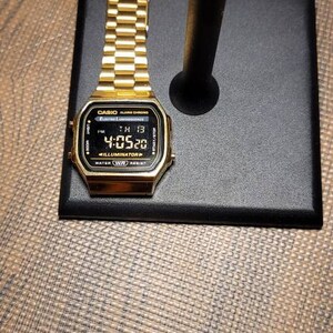 Casio illuminator black gold deals