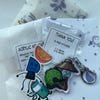 HFJONE Airy Enamel Pin, Acrylic Keychain, and Holographic Vinyl Sticker ...