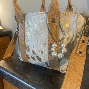 Carolyn added a photo of their purchase