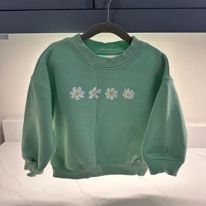 Sarah added a photo of their purchase