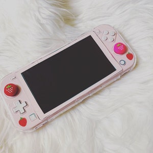 Switch Lite ピンク Amazon.com: Nintendo Switch Lite - Coral - Switch