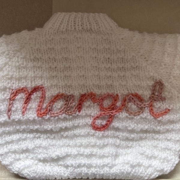 Personalised baby cardigan hand knitted for newborn baby hand