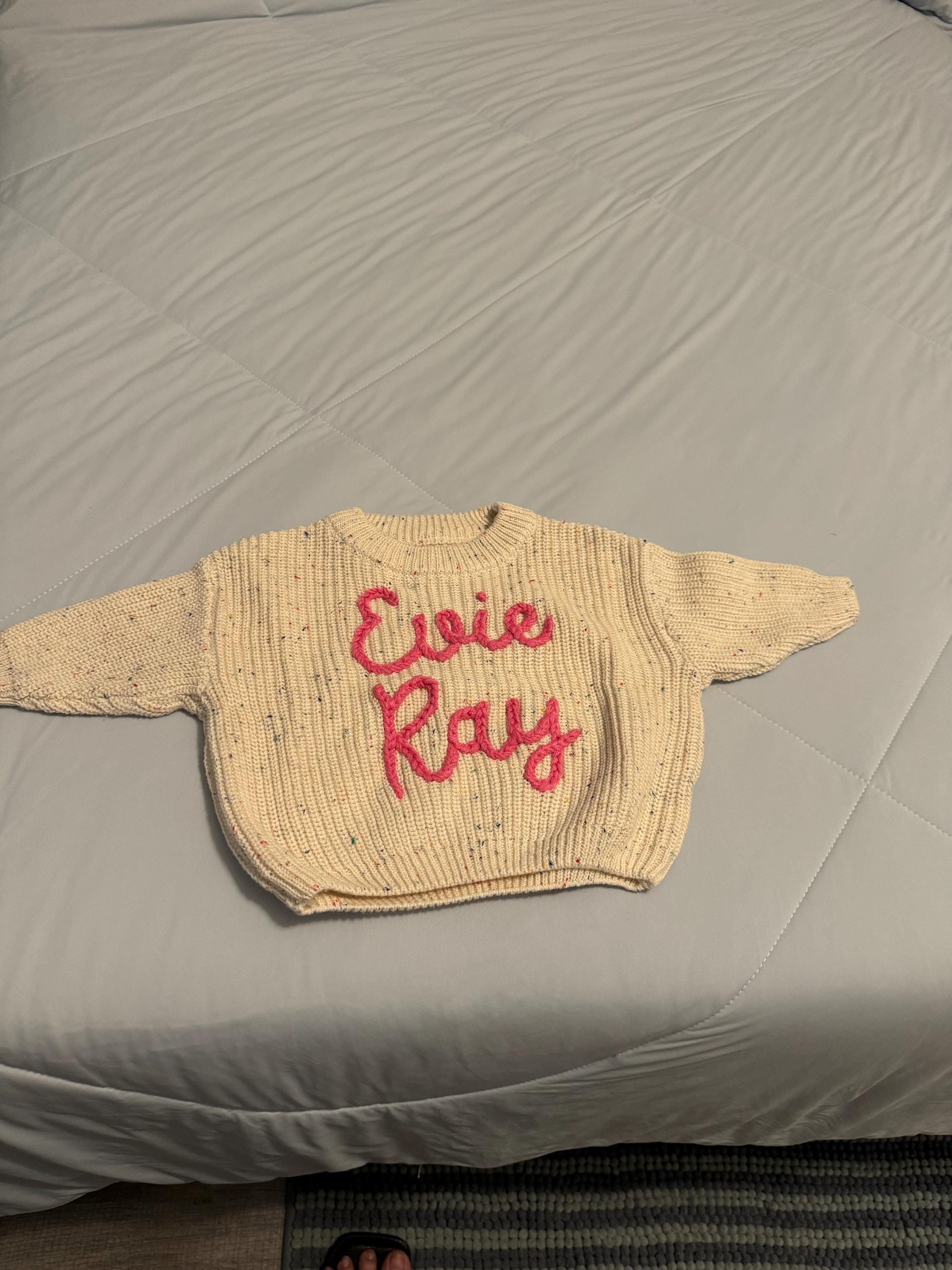 Cherished Custom Baby Sweaters: Personalize Their Name with Exquisite Embroidery