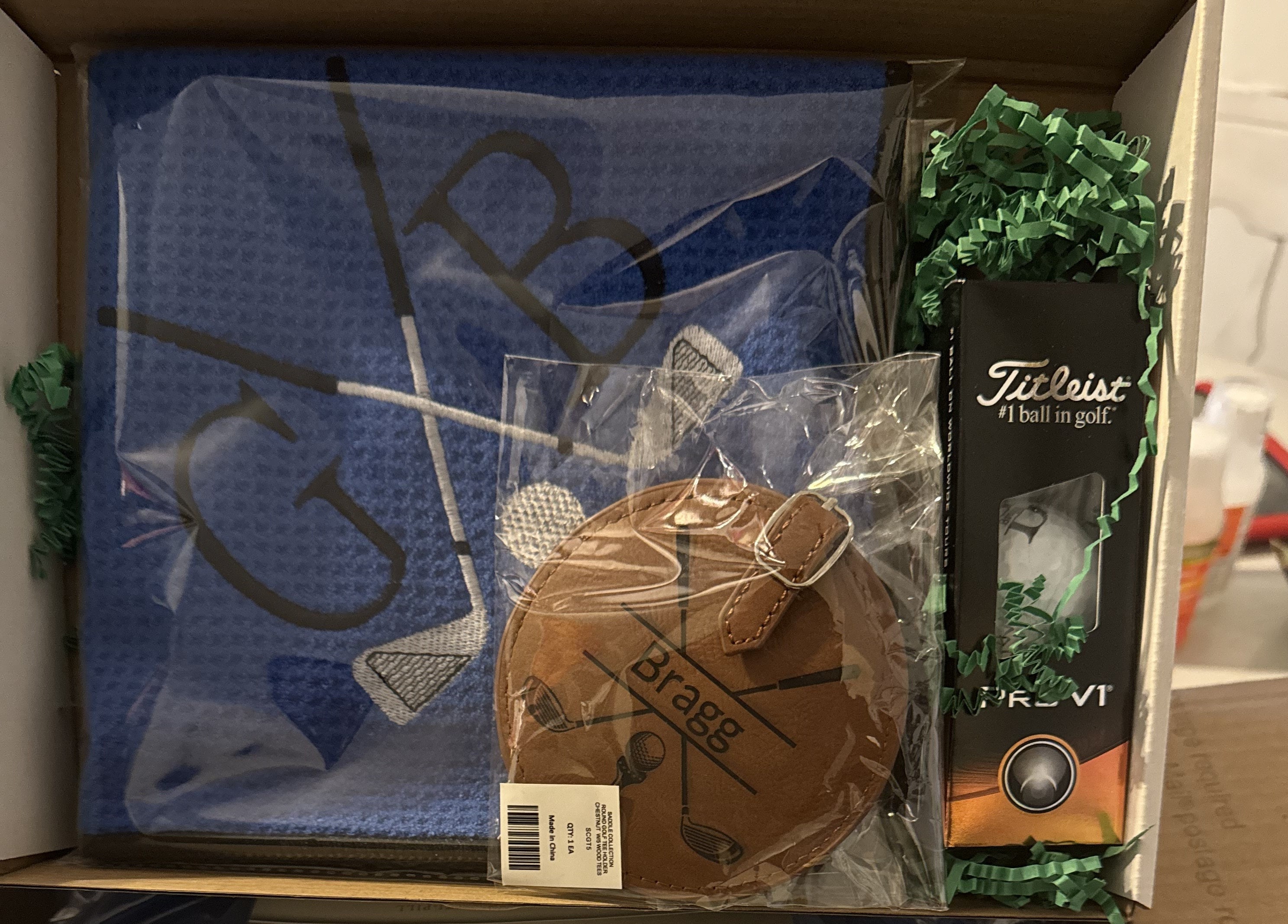 Personalized Golf Gift Box. Include a golf towel, a set of three golf Pro V1 balls with monograms, and a golf bag tag with tee holder