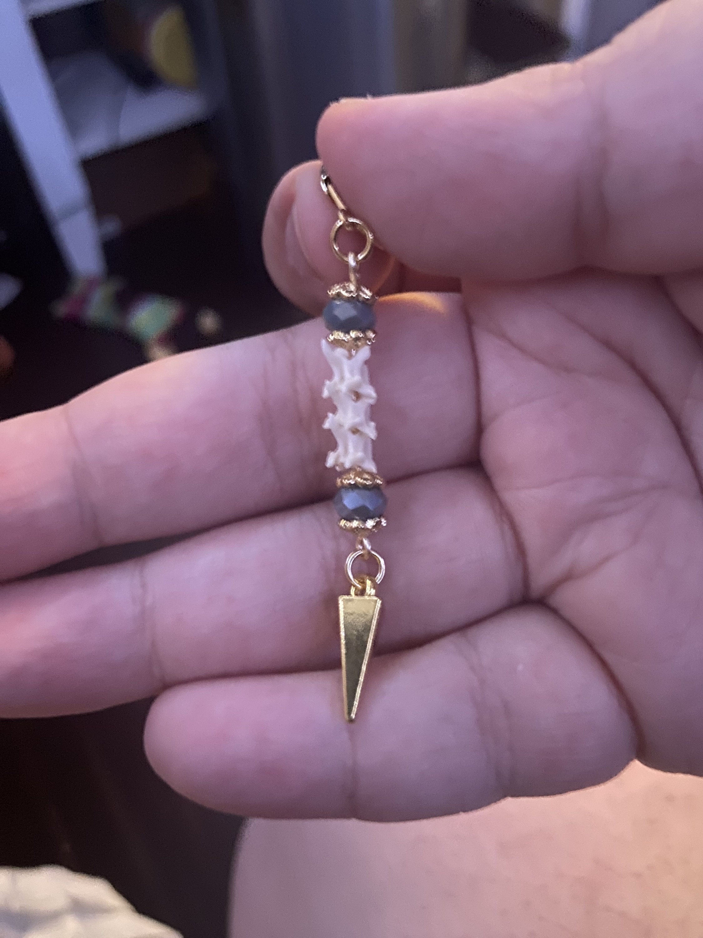 Exquisite Victorian-Era Inspired Coiled Rattlesnake Vertebrae Dangling, Earrings with Intricate Metalwork and Antique Brass Finish