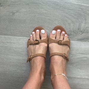 Tatiana added a photo of their purchase