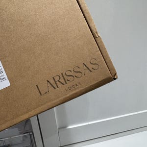 Larissa added a photo of their purchase