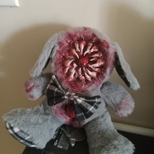gory two headed teddy bear, blood teeth, bloody tooth, gore cute, horror creepy, pink ribbon, red white, menhera yandere, stuffed animal