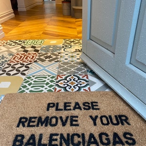 please remove your balenciaga's floor mat