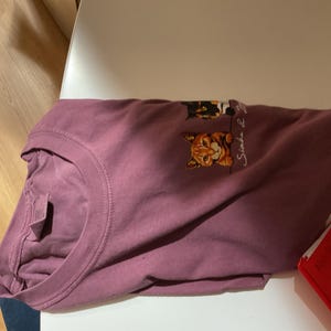 Aimee added a photo of their purchase