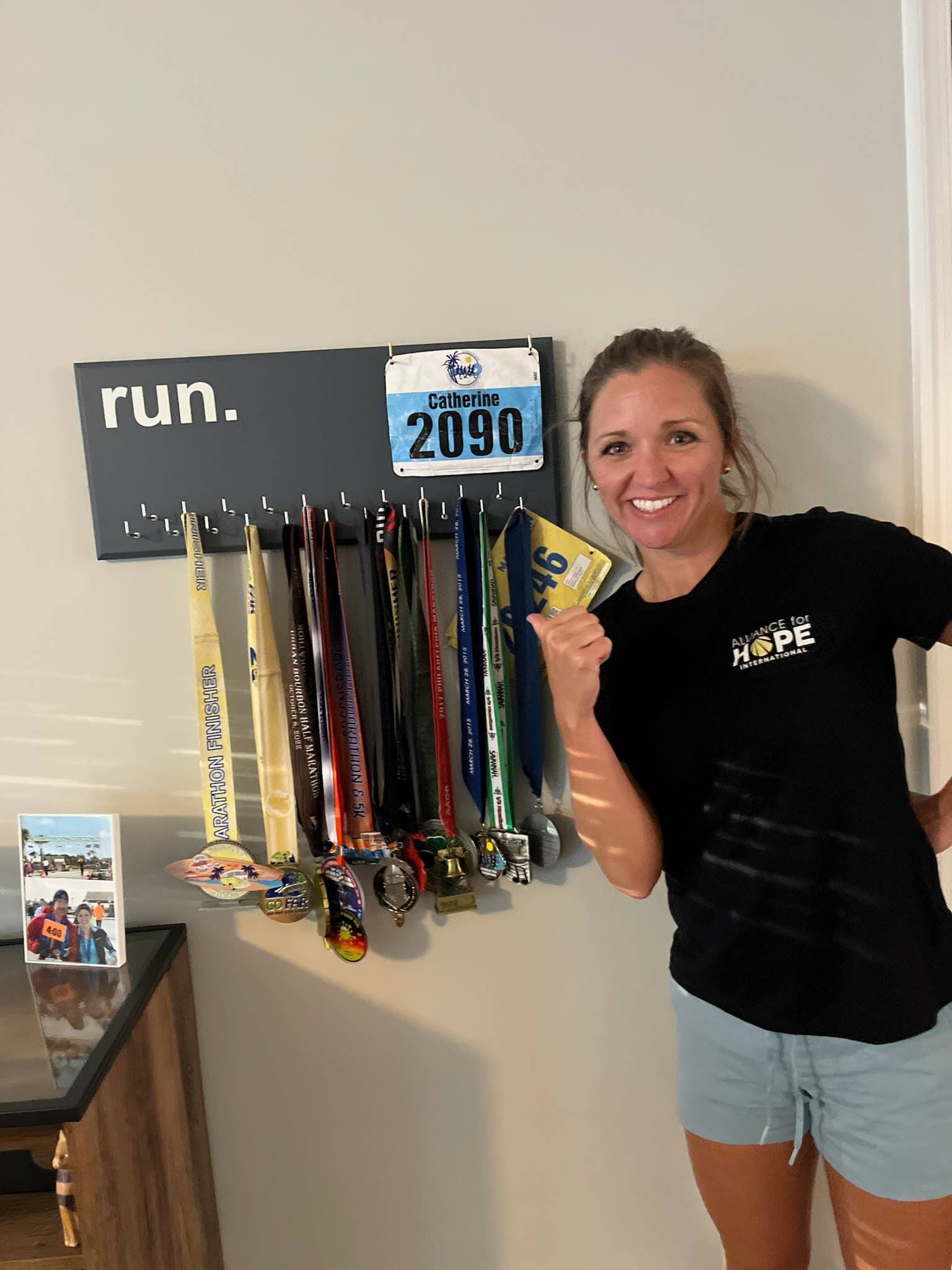 Running Medal Holder, gray or black with chrome "run." vinyl, 21 hooks and BIB holder