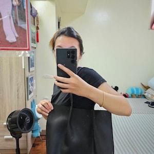 Angelica added a photo of their purchase