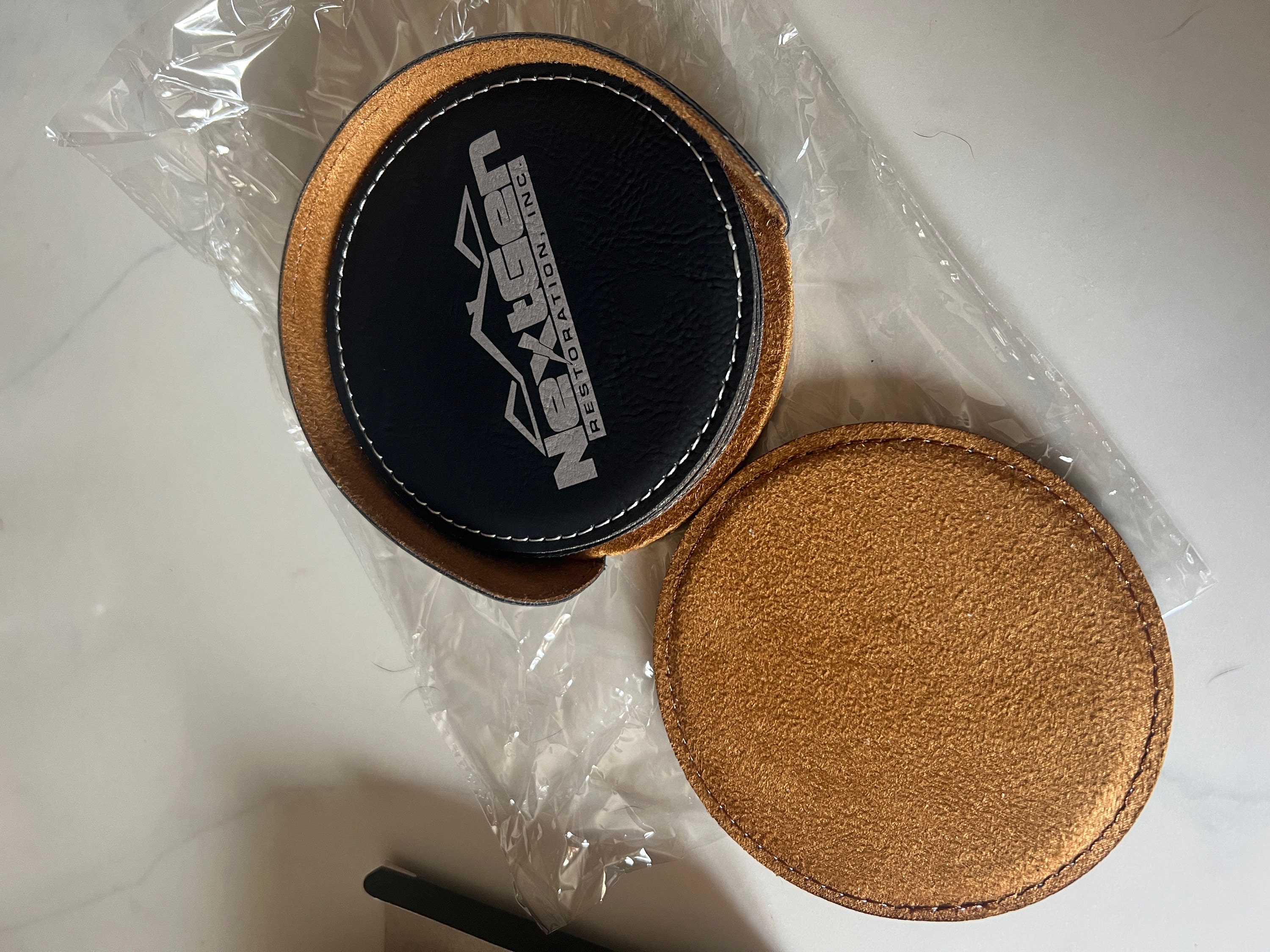 Customer photo of Set of 6 Custom Logo Engraved / Etched Leatherette Coasters with Leatherette Coaster Holder from Jacqueline