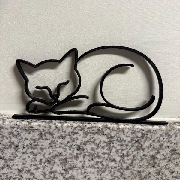 Customer photo of Sleeping Cat Line Art Sculpture in their home