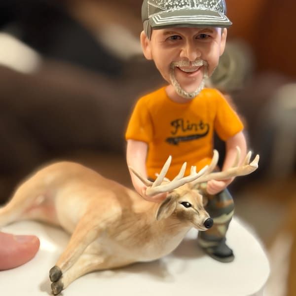 Dan's Etsy review photo of a Hunter bobblehead sculpture