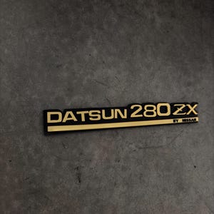 Datsun 280ZX Turbo Emblem Badge Set – Black & Gold Acrylic Plastic