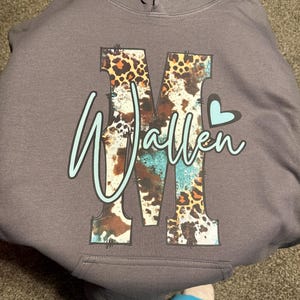 Tina added a photo of their purchase