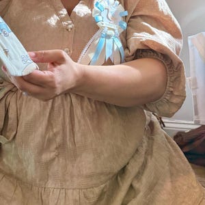 Samantha added a photo of their purchase