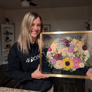 Elaine added a photo of their purchase