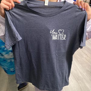 Adrienne added a photo of their purchase