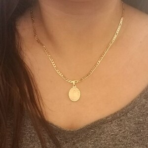 18-Inch Hamilton Gold Plated Necklace with 4mm Light Amethyst Birthstone Beads and Gold Filled Our Lady of Guadalupe Charm. 18-Inch Hamilton Gold Plated Necklace with 4mm Light Amethyst Birthstone Beads and Gold Filled Our Lady of Guadalupe Charm.