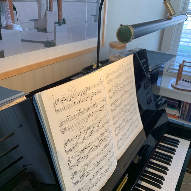 Music stand outlet for upright piano