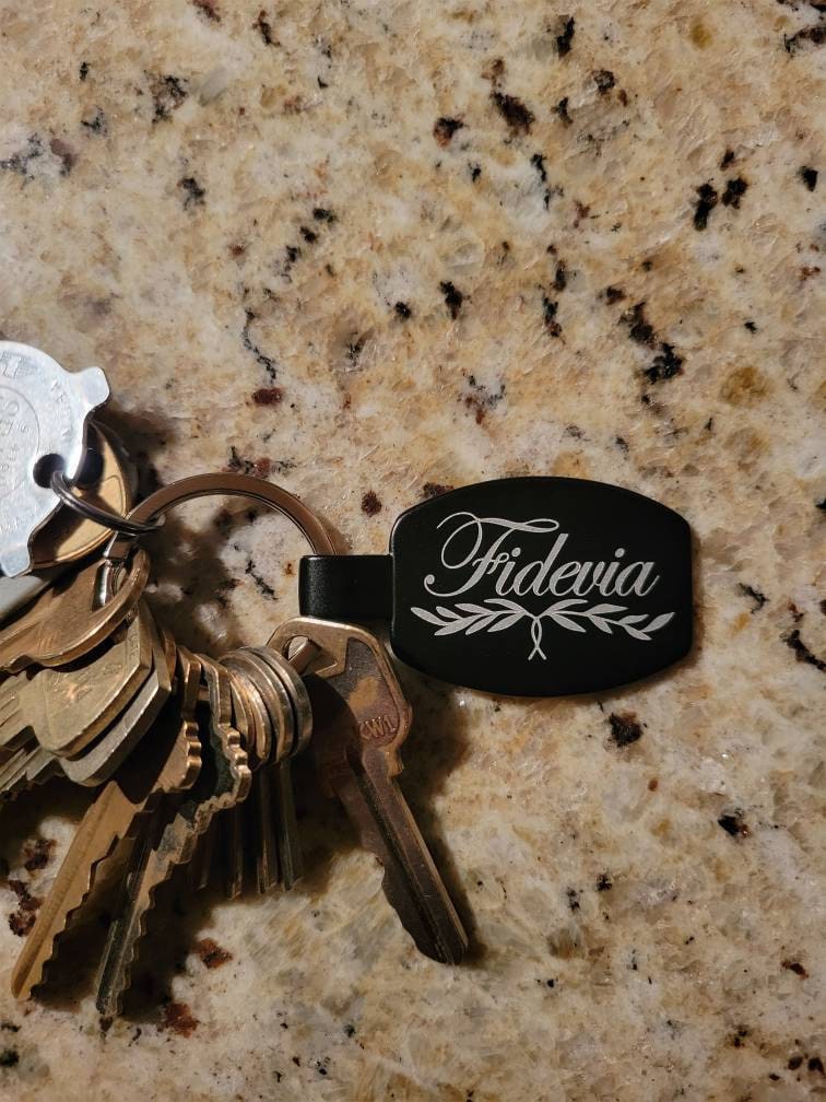 Customer photo of Custom Logo Etched Black Metal Keychains from high