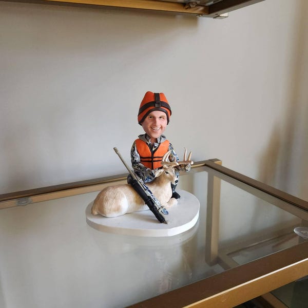 Tanya's Etsy review photo of a Hunter bobblehead statue