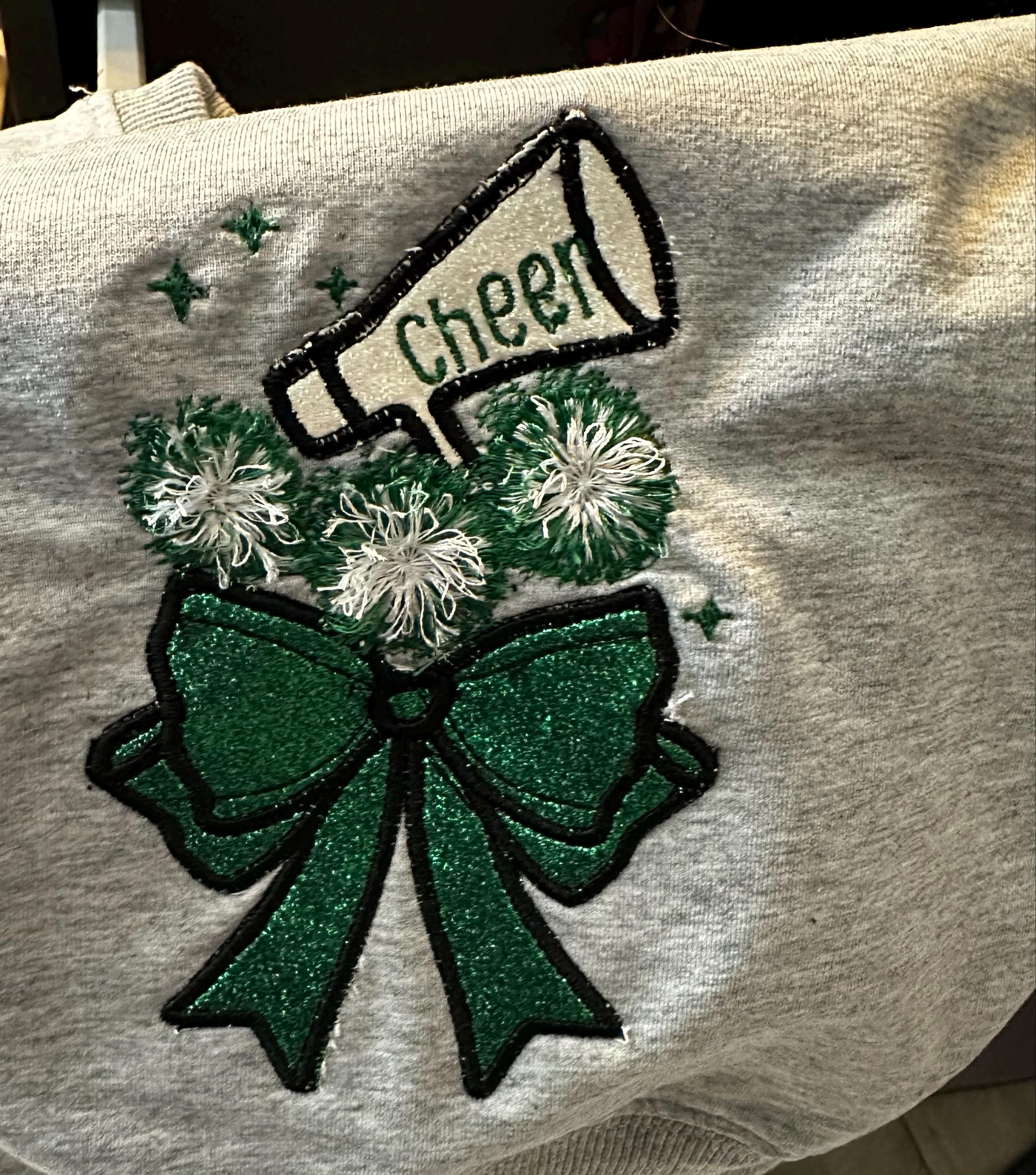 Customer project using Cheerleader Fringed Pom Poms Bow embroidery design