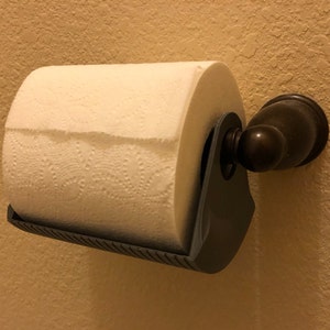 Paper towel holders in the bathroom. Small tray plus room to hold two TP  rolls. Change the roll without that stupid spring. : r/lifehacks
