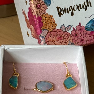 Customer photo, Mismatched Australian Fire Opal Studs, October Birthstone