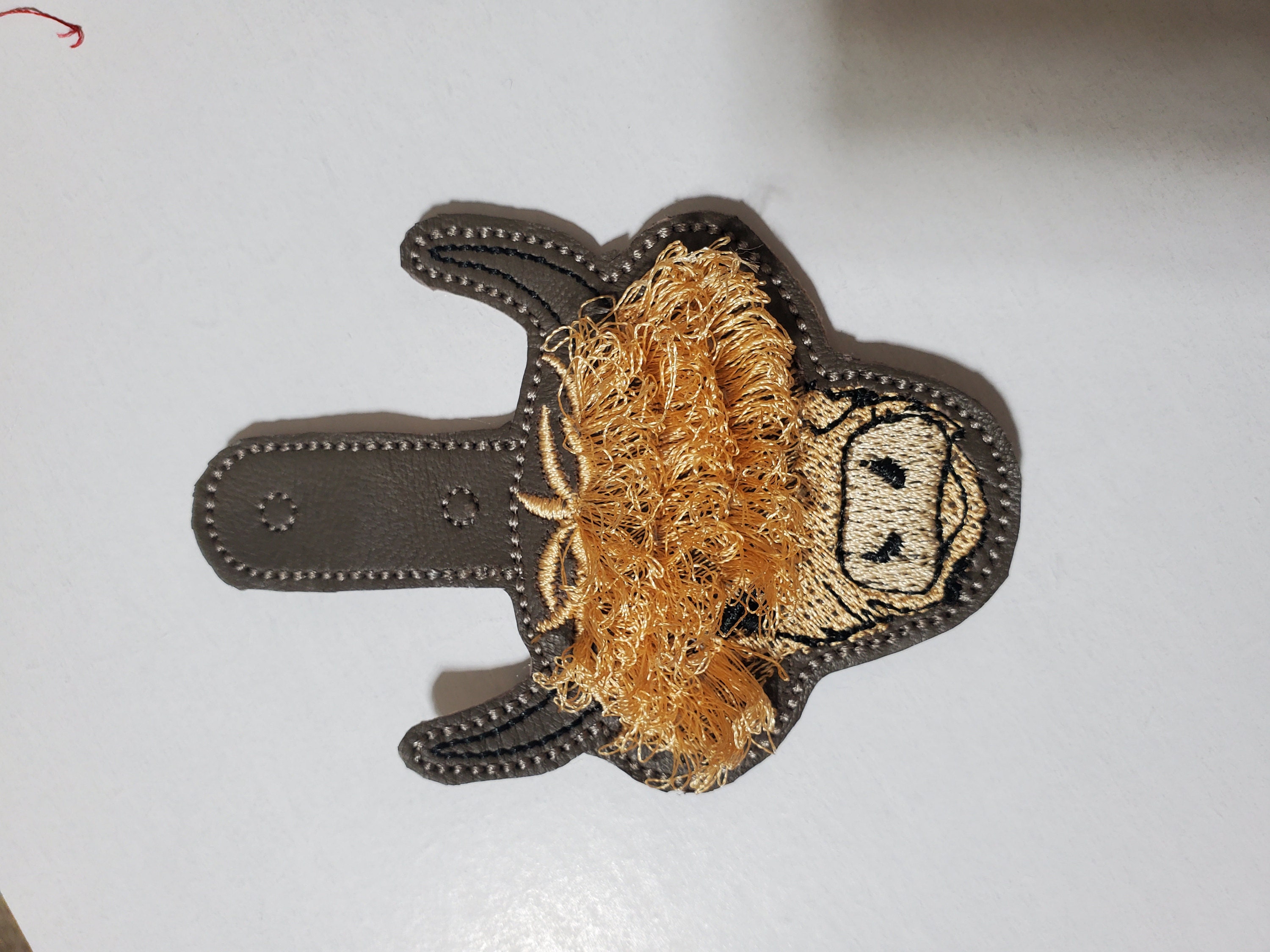 Fringed Highland cow keychain key fob snap tab in the hoop machine embroidery designs ITH project Awesome fluffy fur cow kids backpack tag