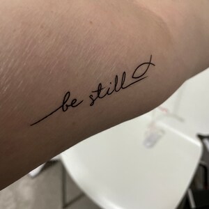 be still and know  Be still tattoo Thigh tattoos women Tiny wrist  tattoos