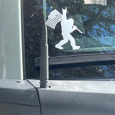 thumbnail image 2 of Sasquatch Bigfoot Rock On Flag Vinyl Decal – Funny Car/Truck Window Sticker 2 of 3