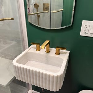 Margot added a photo of their purchase