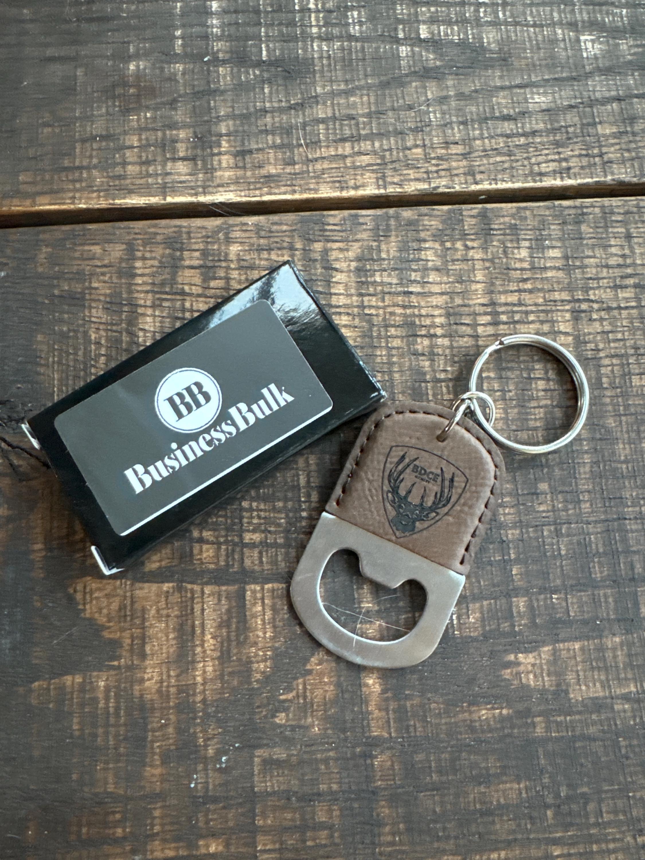 Customer photo of Custom Logo Engraved / Etched Leatherette and Metal Keychain Bottle Opener from Tonya