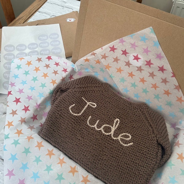 Personalised baby cardigan hand knitted for newborn baby hand