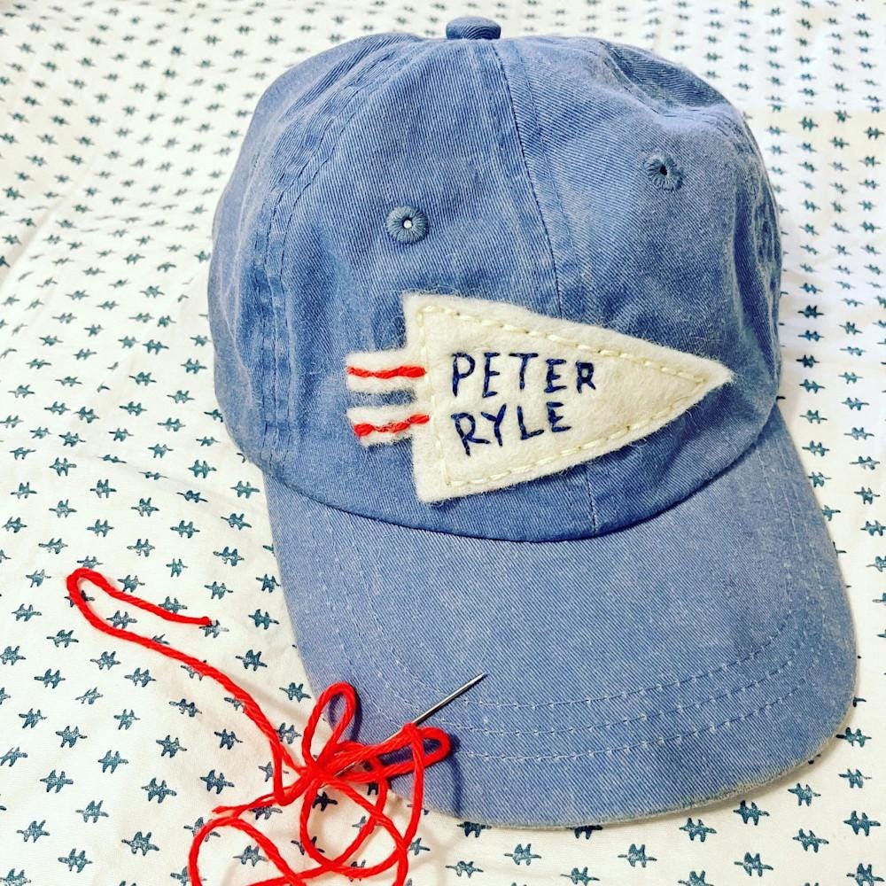 Denim hat with personalized name pennant
