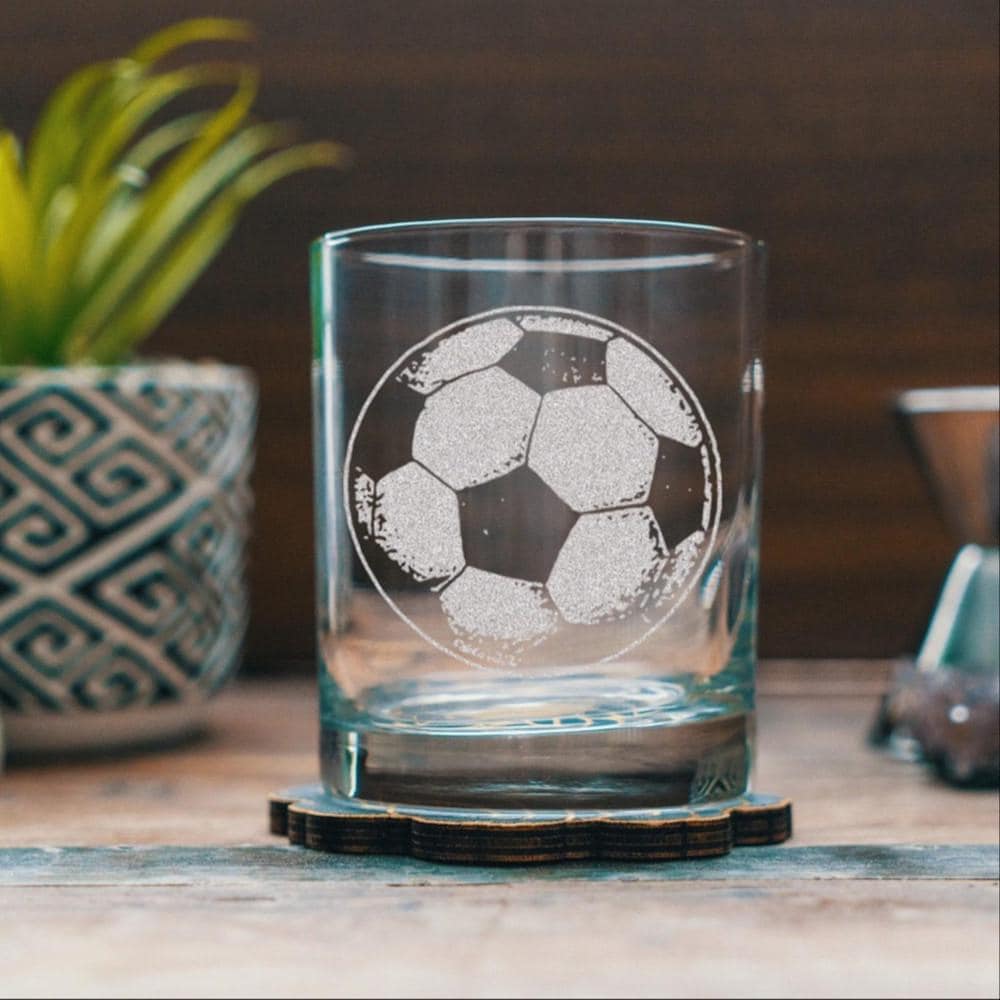 Glass with football ball etched on it