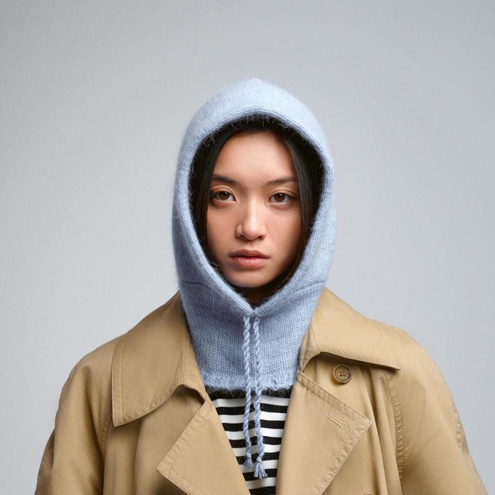 Woman wearing a crochet blue wool balaclava