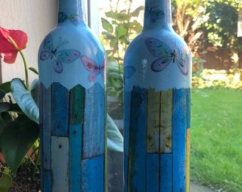 Upcycled glass bottles,decoupaged