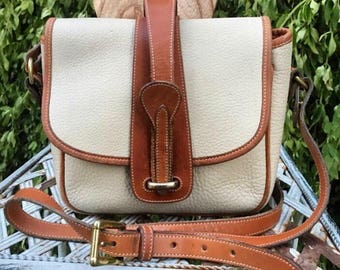 Vintage Dooney and Bourke All Weather Leather Marble Saddle bag bone and british tan color