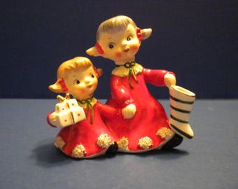 Norcrest Sisters Christmas Figurine One with Present and One with Stocking