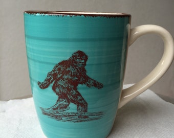 Sasquatch Turquoise Blue and Cream Colored Ceramic Coffee Cup