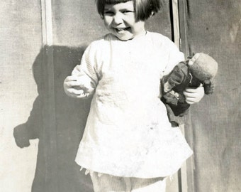 Vintage photo little girl cutie pie holds toy doll RPPC
