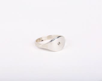 Sterling silver signet ring with flush set diamond