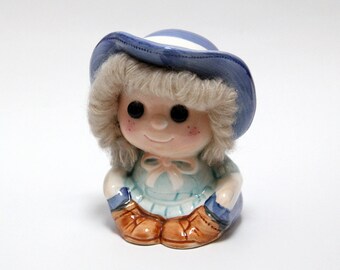 Vintage ceramic girl money-box with wool hair detail