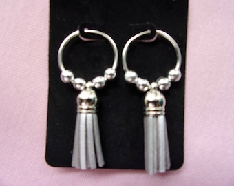 Silver beaded continuous hoops with tassel